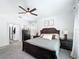 Cozy main bedroom featuring a comfortable bed, elegant decor, and natural light at 3708 Alafia Creek St, Plant City, FL 33567