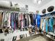 Organized walk-in closet with ample storage, including shelving and rods for hanging clothes and shoes at 3708 Alafia Creek St, Plant City, FL 33567