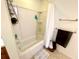 Clean bathroom showcasing a white shower-tub combo and towel rack at 6698 Wirevine Dr, Brooksville, FL 34602