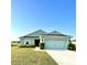 Charming one-story home featuring a well-manicured lawn and a two-car garage at 6698 Wirevine Dr, Brooksville, FL 34602