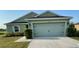 Charming single-story home with a well-maintained lawn and a two-car garage at 6698 Wirevine Dr, Brooksville, FL 34602