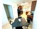 Kitchen and dining area, complete with black appliances and tile flooring at 6698 Wirevine Dr, Brooksville, FL 34602