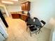 Kitchen with adjoining dining area, showcasing tile flooring and a functional layout at 6698 Wirevine Dr, Brooksville, FL 34602