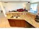 Open concept kitchen with breakfast bar overlooking the cozy living room at 6698 Wirevine Dr, Brooksville, FL 34602