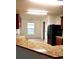 Bright kitchen space featuring granite countertops, black appliances, and tile flooring at 6698 Wirevine Dr, Brooksville, FL 34602