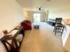 Spacious living room featuring plush carpeting and a sliding glass door for ample natural light at 6698 Wirevine Dr, Brooksville, FL 34602