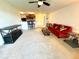 Bright open-concept living room, showcasing access to the kitchen and comfortable seating at 6698 Wirevine Dr, Brooksville, FL 34602