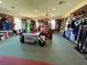 A view of the Pro Shop that includes clothing racks, golf bags and a cashier station at 6698 Wirevine Dr, Brooksville, FL 34602