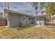 View of the backyard with a door and AC unit at 5330 Dr Martin Luther King Jr St S, St Petersburg, FL 33705