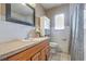Bathroom with white tile and wood vanity at 5330 Dr Martin Luther King Jr St S, St Petersburg, FL 33705