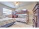 Bedroom with a ceiling fan and bunk beds at 5330 Dr Martin Luther King Jr St S, St Petersburg, FL 33705