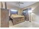 Serene bedroom featuring a large bed, matching furniture set, providing a peaceful retreat, with tile flooring at 5330 Dr Martin Luther King Jr St S, St Petersburg, FL 33705