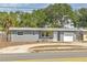 Charming single-story home with a one car garage and landscaped front yard at 5330 Dr Martin Luther King Jr St S, St Petersburg, FL 33705