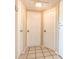 Hallway with white doors and tile flooring at 5330 Dr Martin Luther King Jr St S, St Petersburg, FL 33705