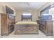 This is the main bedroom with TV and wood furnishings at 5330 Dr Martin Luther King Jr St S, St Petersburg, FL 33705