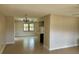 View of the open living space showcasing tile flooring and connections to other living areas at 9219 Bladon St, Spring Hill, FL 34608