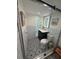 Cozy bathroom with detailed floors, subway tile and a frameless glass shower with bench at 33 S Gulfstream Ave # 803, Sarasota, FL 34236