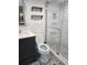 Modern bathroom with white subway tile, glass shower, and patterned tile flooring at 33 S Gulfstream Ave # 803, Sarasota, FL 34236