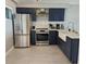 Updated kitchen with stainless steel appliances, granite countertops, and modern cabinetry at 33 S Gulfstream Ave # 803, Sarasota, FL 34236