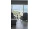 Inviting living room with panoramic waterfront views and comfortable seating area at 33 S Gulfstream Ave # 803, Sarasota, FL 34236