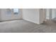 Large bedroom features two windows, neutral carpeting, and white walls at 200 Eagleston Ln, Lakewood Ranch, FL 34240