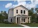 Charming two-story home with a quaint front porch and craftsman-style architectural details at 208 Eagleston Ln, Lakewood Ranch, FL 34240