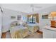 Charming bedroom with twin beds, natural light, and a calming color palette at 12300 Vonn Rd # 1102, Largo, FL 33774
