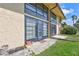 Exterior of a home with a patio and lots of windows providing natural light, adding curb appeal to the property at 12300 Vonn Rd # 1102, Largo, FL 33774