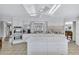Modern kitchen featuring an island, white cabinets, and stainless steel appliances, perfect for culinary enthusiasts at 12300 Vonn Rd # 1102, Largo, FL 33774