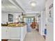 View from the kitchen showcasing an open floor plan leading into the bright and airy living room at 12300 Vonn Rd # 1102, Largo, FL 33774