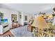 Cozy living room showcasing a decorative rug and open floor plan leading to the kitchen at 12300 Vonn Rd # 1102, Largo, FL 33774
