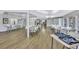 Spacious meeting room featuring tables, chairs, and ample space for community gatherings and events at 12300 Vonn Rd # 1102, Largo, FL 33774
