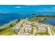 Stunning aerial view of a waterfront community with colorful homes and beautiful landscaping at 283 Saint Lucia Dr # 101, Bradenton, FL 34209