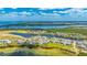 Beautiful aerial view of a waterfront community featuring homes surrounding a scenic pond at 283 Saint Lucia Dr # 101, Bradenton, FL 34209