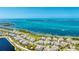 A coastal community aerial view boasting waterfront homes with ocean views, showcasing the stunning seaside living experience at 283 Saint Lucia Dr # 101, Bradenton, FL 34209