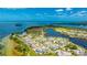 A stunning aerial shot of the community, showing homes nestled along the waterways and the scenic ocean backdrop at 283 Saint Lucia Dr # 101, Bradenton, FL 34209