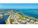 Overhead view showcasing waterfront community and the ocean, highlighting the prime location at 283 Saint Lucia Dr # 101, Bradenton, FL 34209