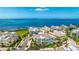 Scenic aerial shot of a colorful waterfront community with ocean views and well-maintained landscaping at 283 Saint Lucia Dr # 101, Bradenton, FL 34209