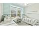 Charming bedroom with twin beds, a window desk, and nautical decor creating a cozy space at 283 Saint Lucia Dr # 101, Bradenton, FL 34209