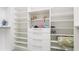 Walk-in closet features custom shelving and storage options at 283 Saint Lucia Dr # 101, Bradenton, FL 34209
