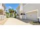 Townhome exterior with a private garage, tidy landscaping, and a paved driveway at 283 Saint Lucia Dr # 101, Bradenton, FL 34209