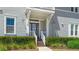 Inviting entryway featuring a glass-paneled front door and attractive landscaping at 283 Saint Lucia Dr # 101, Bradenton, FL 34209