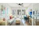 The living room features shutters on the windows and an abundance of natural light at 283 Saint Lucia Dr # 101, Bradenton, FL 34209