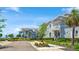 A street view of coastal homes with balconies and lush landscaping in a vibrant, waterfront community at 283 Saint Lucia Dr # 101, Bradenton, FL 34209