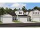Charming townhome exterior with a two car garage and manicured landscaping at 7575 Sea Oak Ct, Parrish, FL 34219
