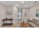 Hallway with access to rooms and living area, featuring decor and neutral carpet at 7575 Sea Oak Ct, Parrish, FL 34219