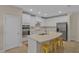 Modern kitchen featuring white cabinetry, stainless steel appliances, and a center island at 7575 Sea Oak Ct, Parrish, FL 34219