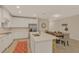 Bright kitchen features white cabinetry, stainless steel appliances, and an island with seating at 7575 Sea Oak Ct, Parrish, FL 34219