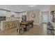 Bright kitchen featuring white cabinetry, stainless steel appliances, and tile flooring at 7575 Sea Oak Ct, Parrish, FL 34219