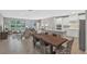 Open-concept living area with tile floors and a combined kitchen and living room at 7575 Sea Oak Ct, Parrish, FL 34219